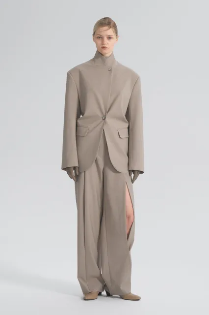 Trousers with a slit at the hip
