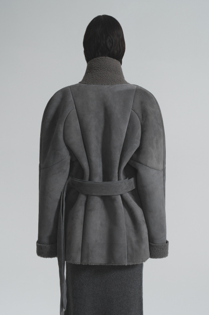 Sheepskin coat made of curly fur with a belt