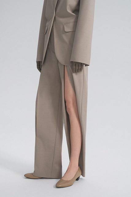 Trousers with a slit at the hip