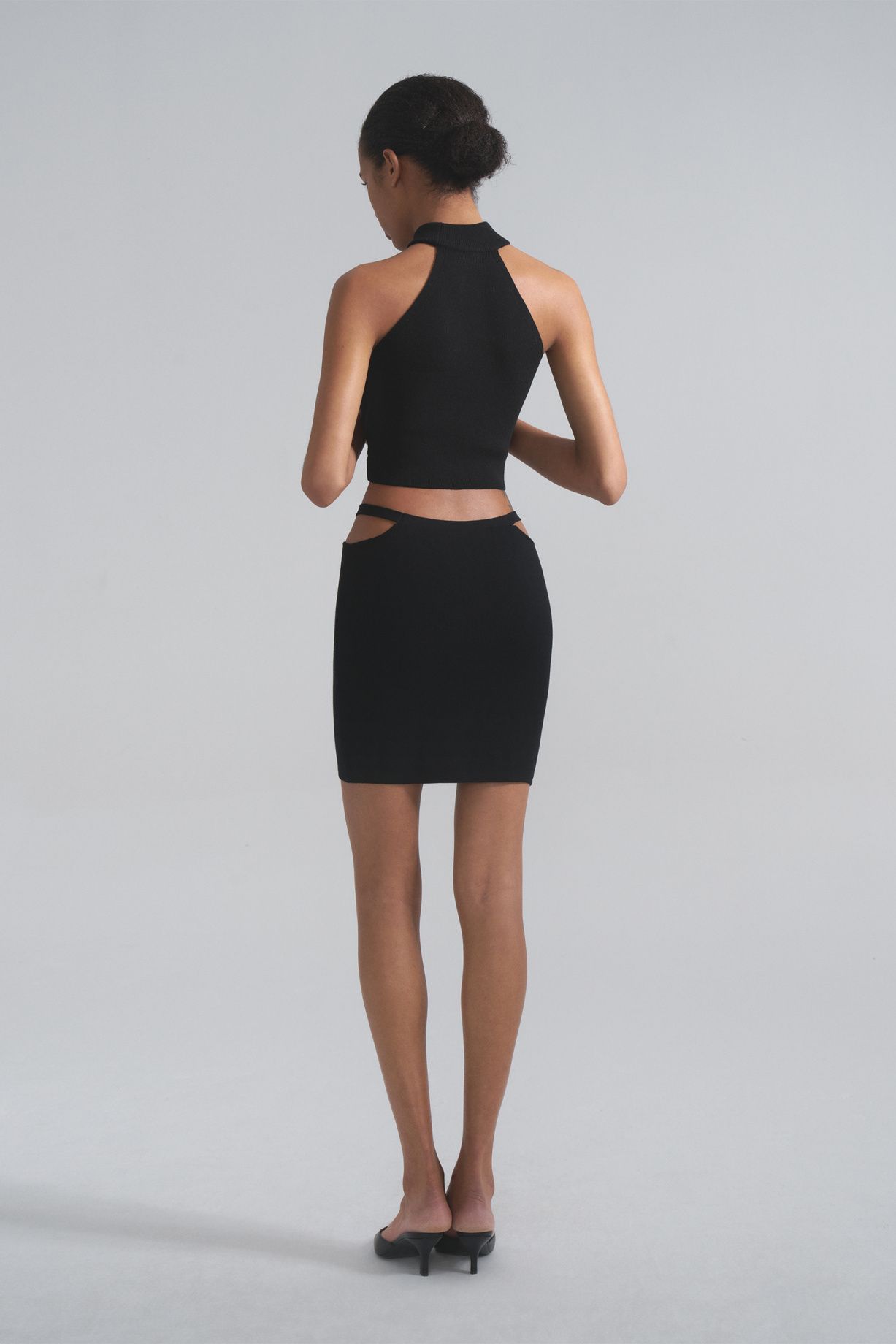 Mini skirt with decorative straps