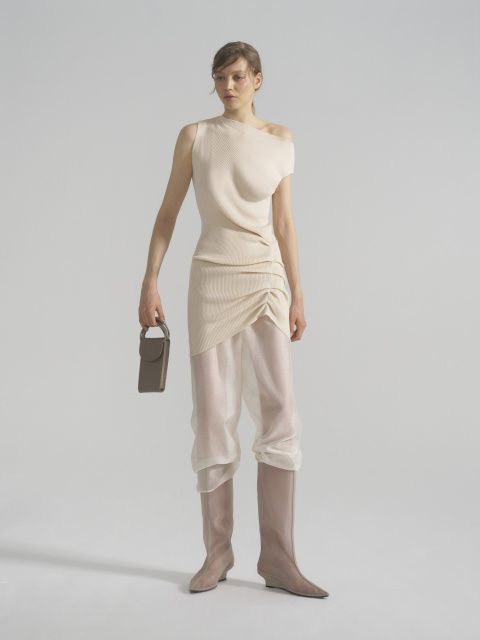 The vest dress is asymmetrical