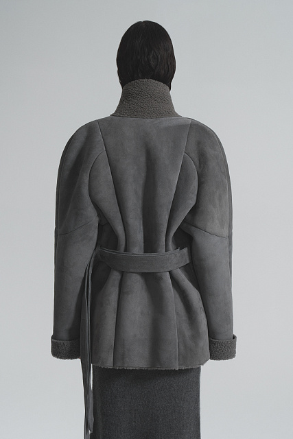 Sheepskin coat made of curly fur with a belt