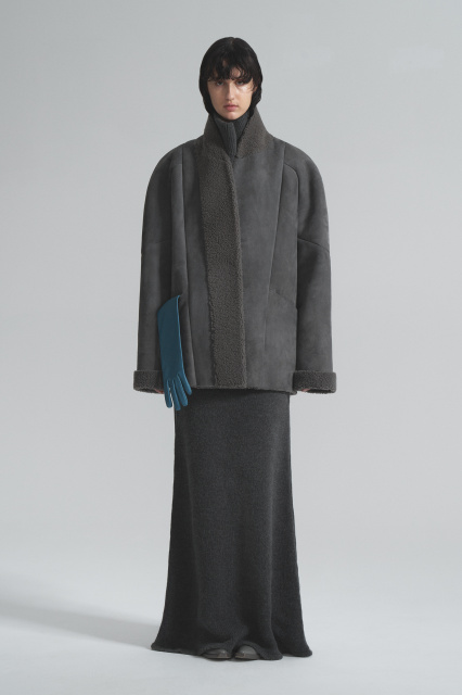 Sheepskin coat made of curly fur with a belt