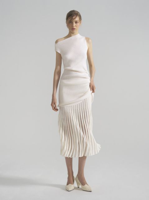 The vest dress is asymmetrical