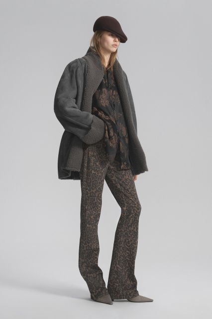 Sheepskin coat made of curly fur with a belt